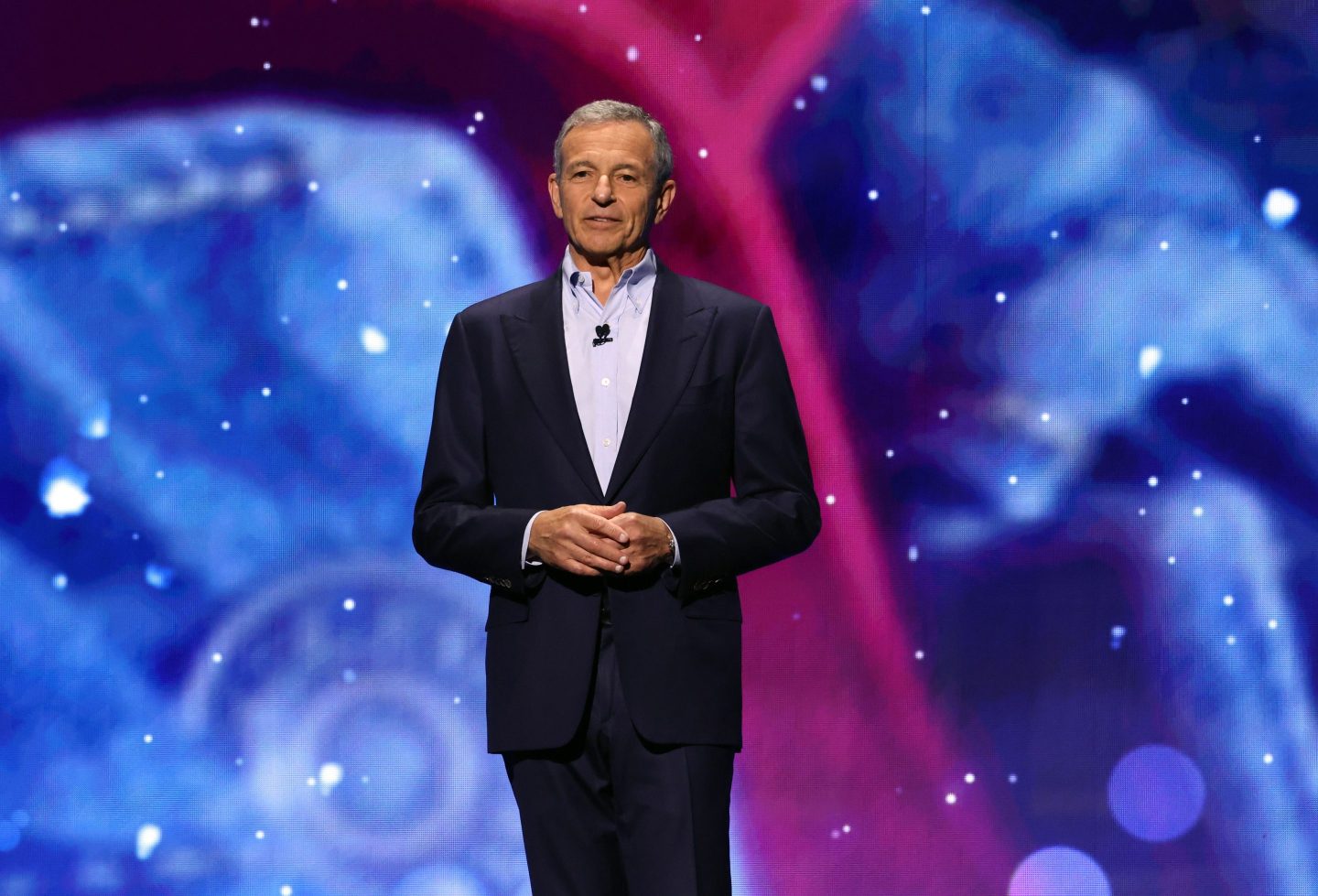 Disney CEO Bob Iger holds his hands, as if he's apologizing