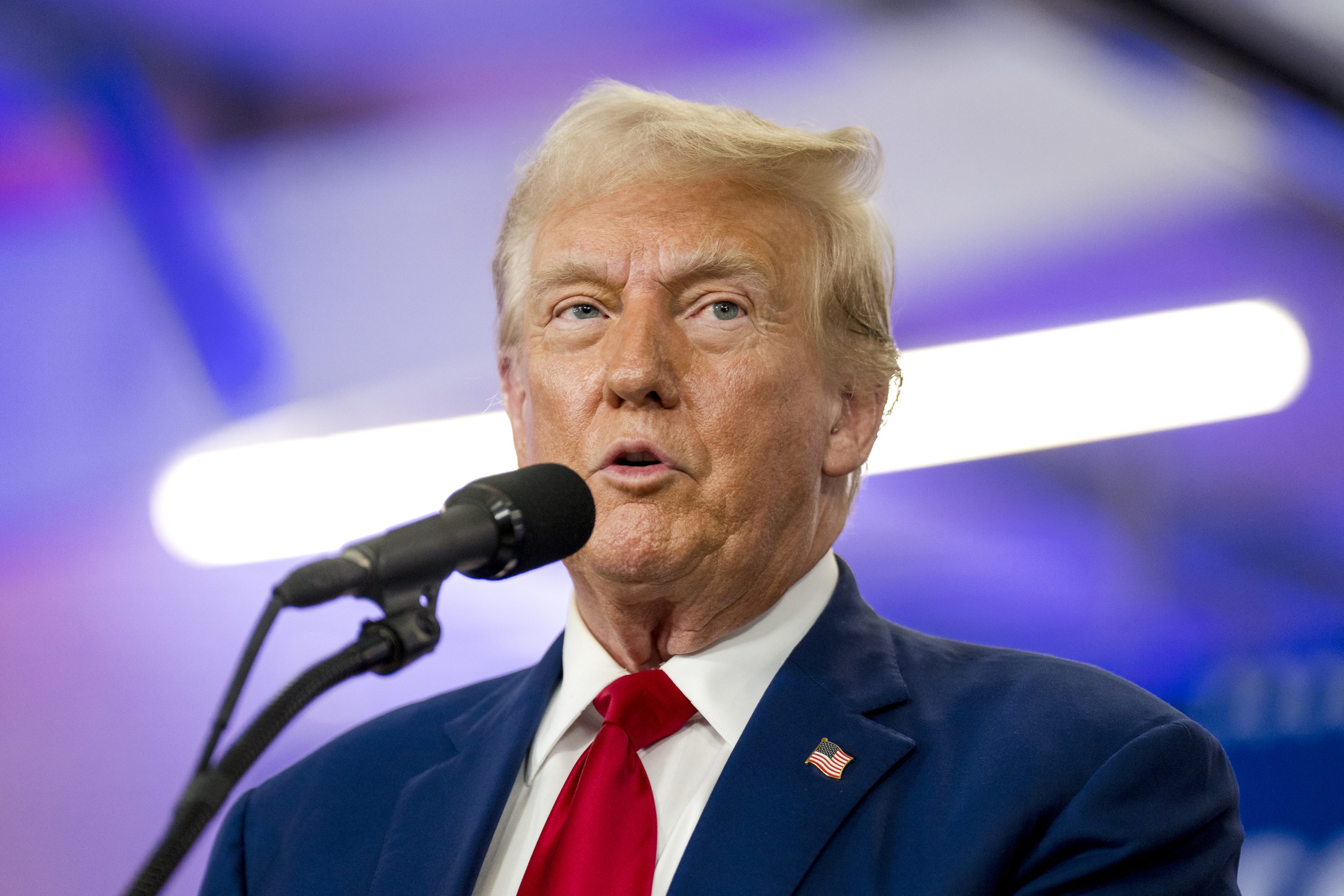 Donald Trump speaks into microphone