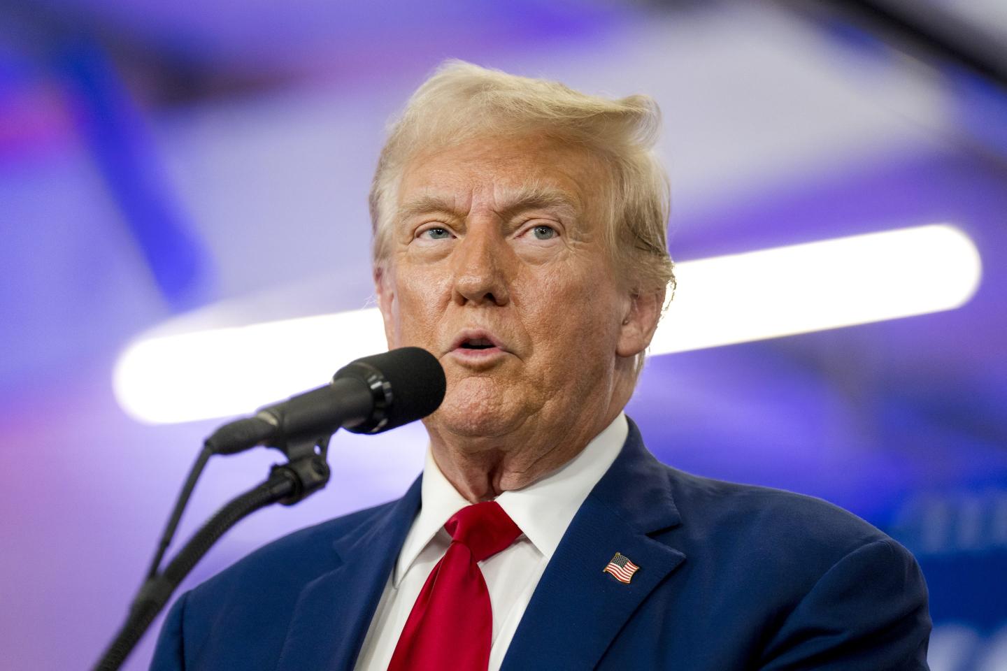 Donald Trump speaks into microphone