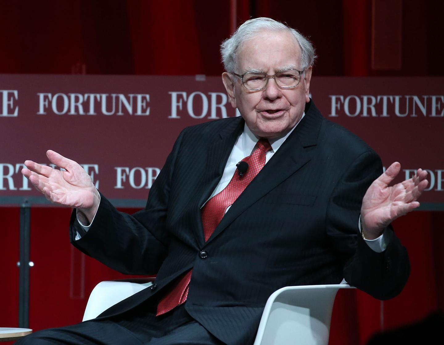 Warren Buffett gestures with hands
