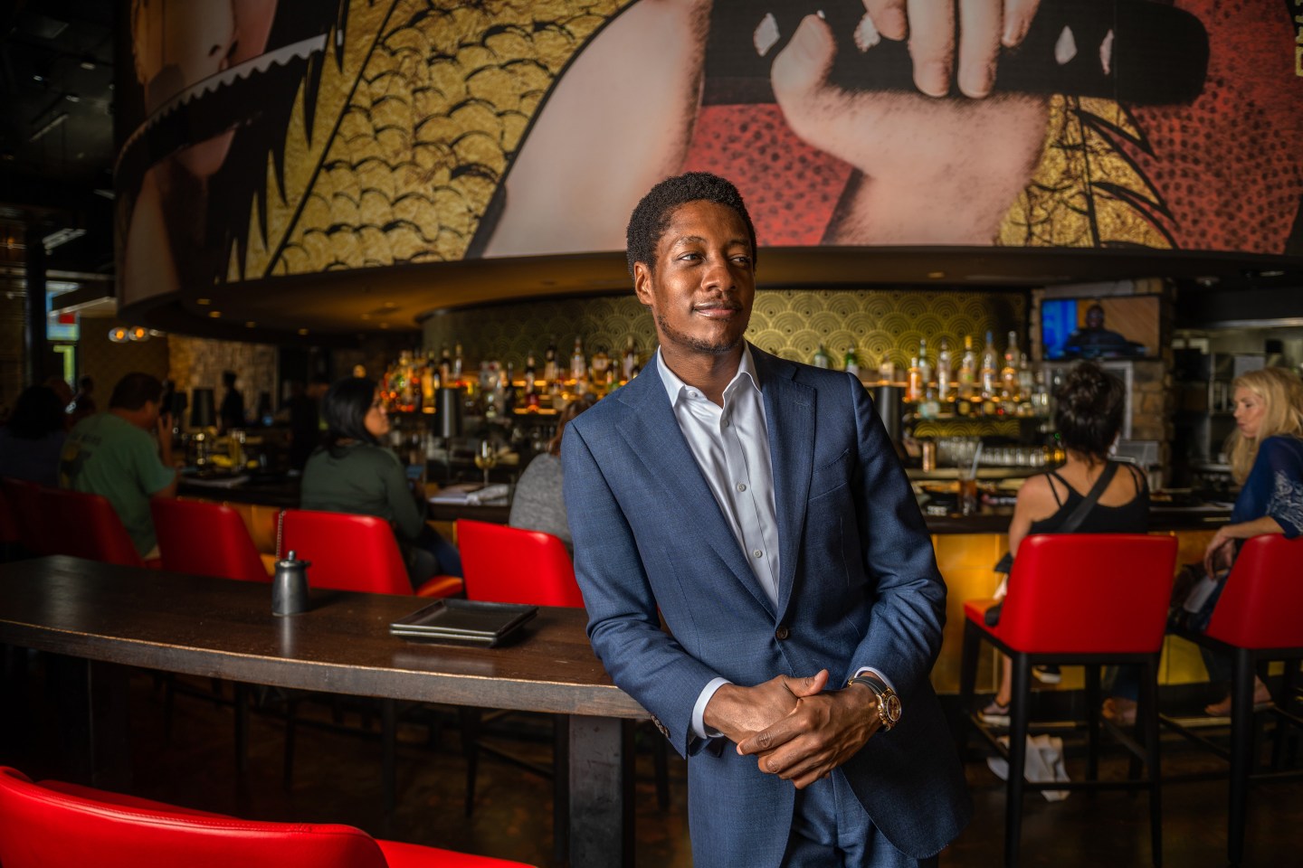 Damola Adamolekun poses for a portrait at P.F. Chang's in Scottsdale, Arizona on Friday, Oct. 21, 2022.