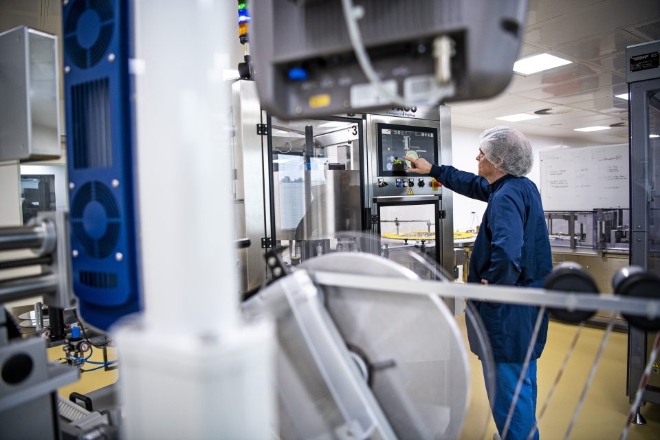 an elderly person seen using a machine