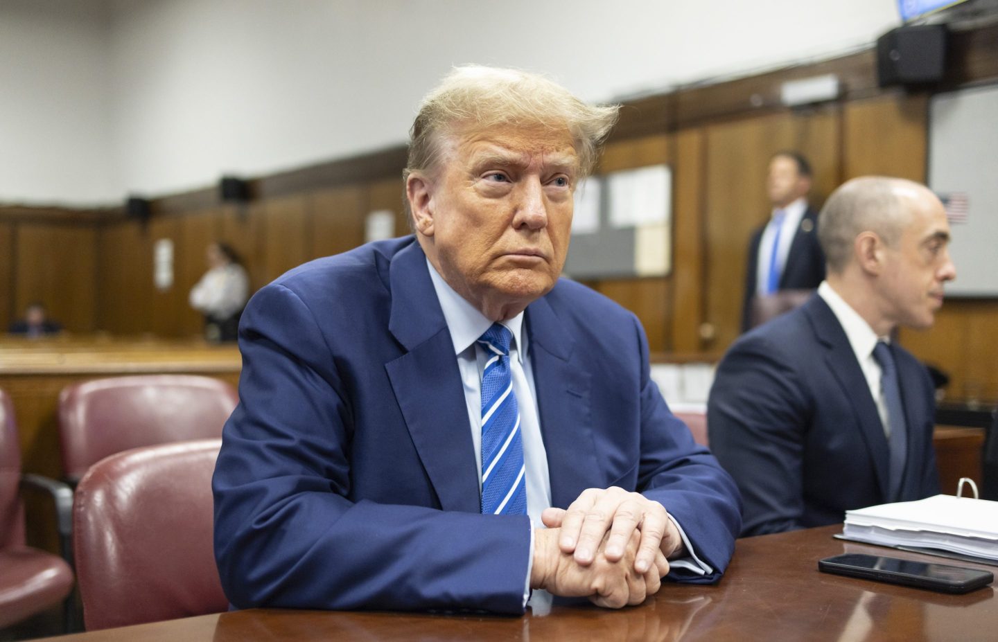 Former President Donald Trump awaits the start of proceedings on the second day of jury selection at Manhattan criminal court, April 16, 2024, in New York.