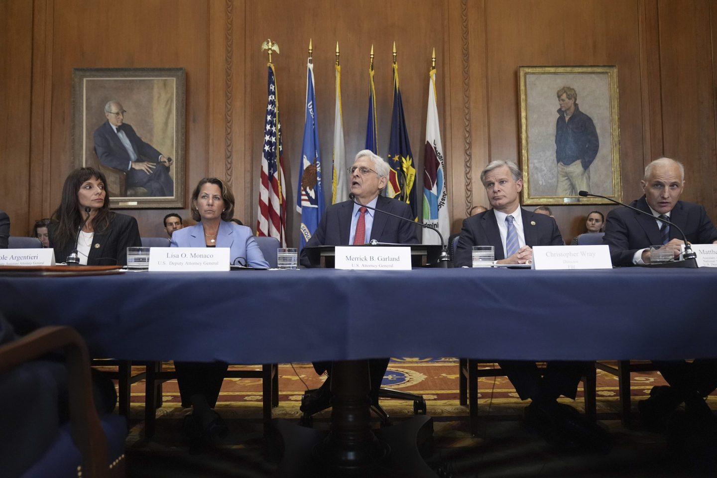 Attorney General Merrick Garland, center, speaks before a meeting of the Justice Department's Election Threats Task Force, at the Department of Justice, Wednesday, Sept. 4, 2024, in Washington.
