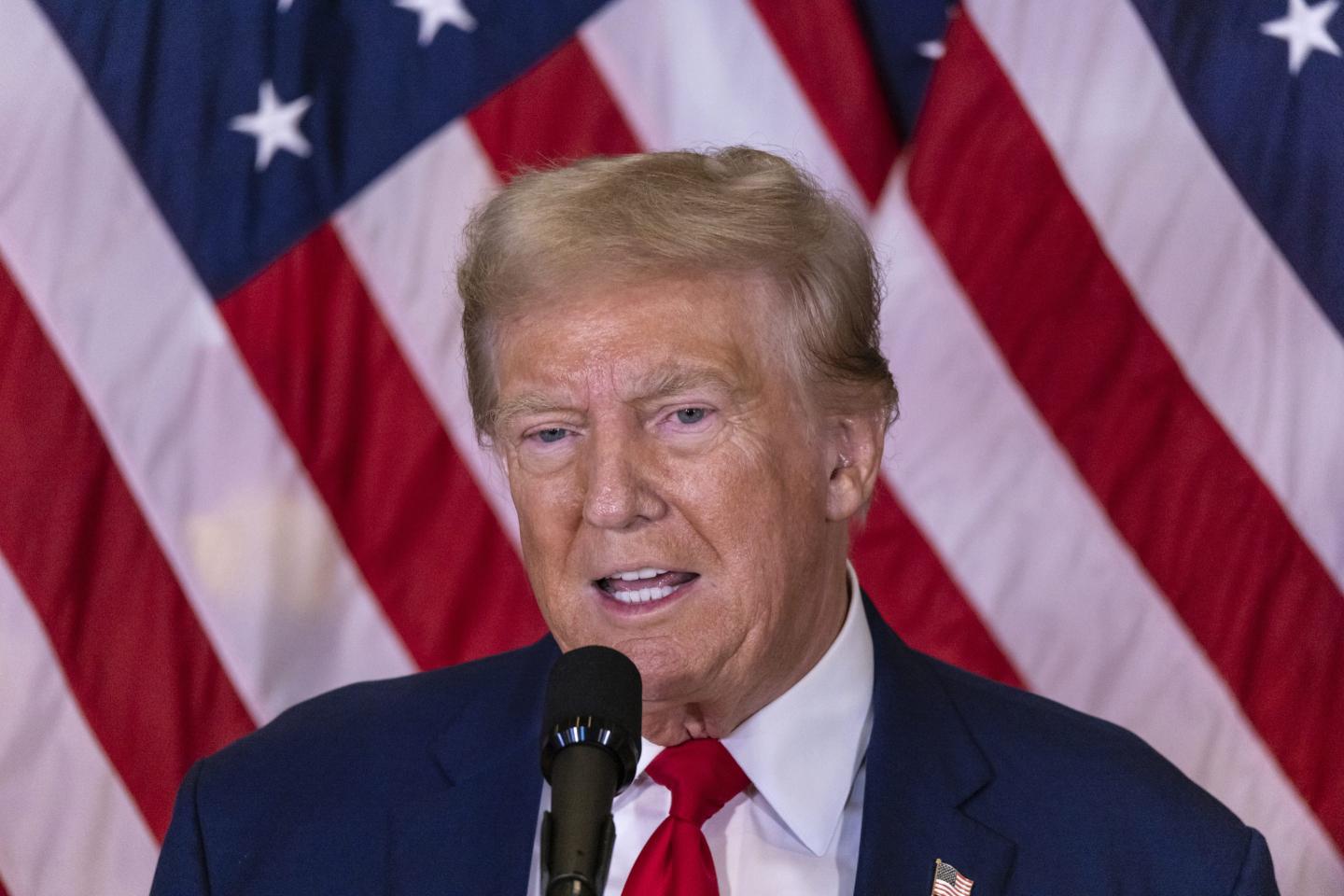 Donald Trump speaks into microphone