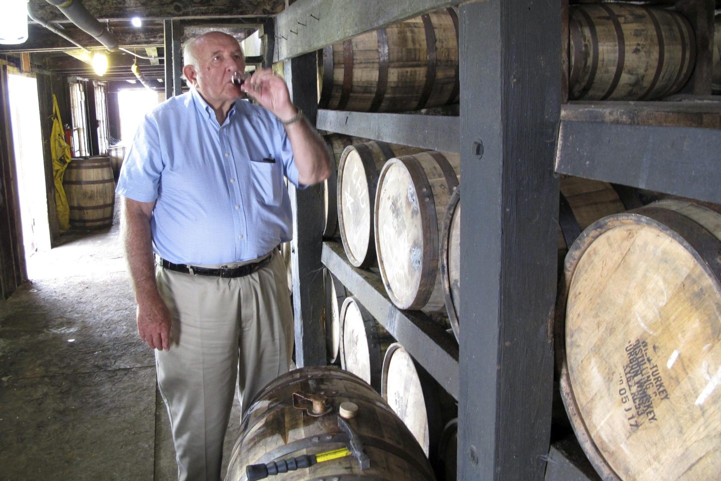 Wild Turkey master distiller Jimmy Russell takes a sip of bourbon drawn from the barrel at a warehouse near Lawrenceburg, Ky., Aug. 22, 2014.