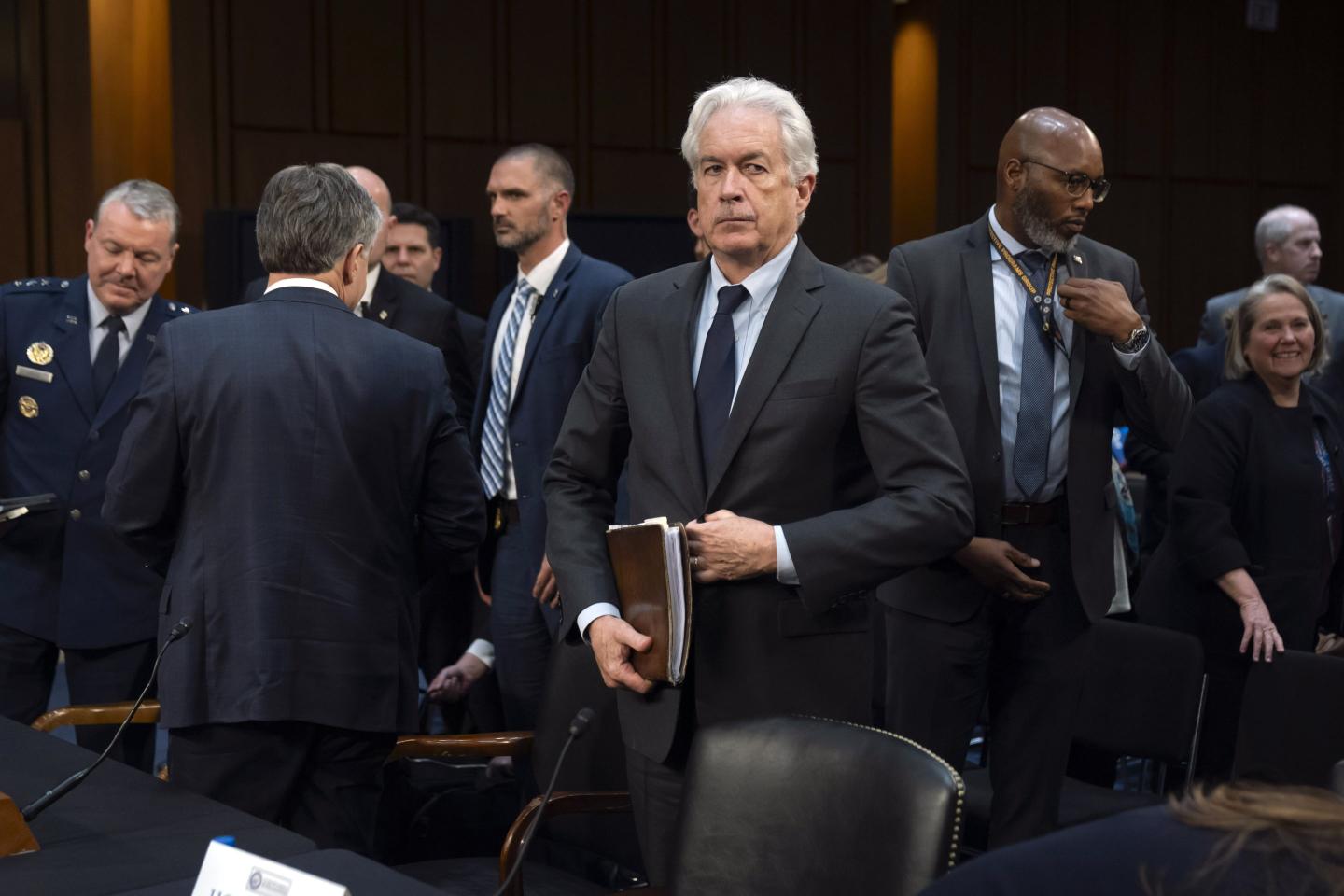 CIA director William Burns stands in a courtroom