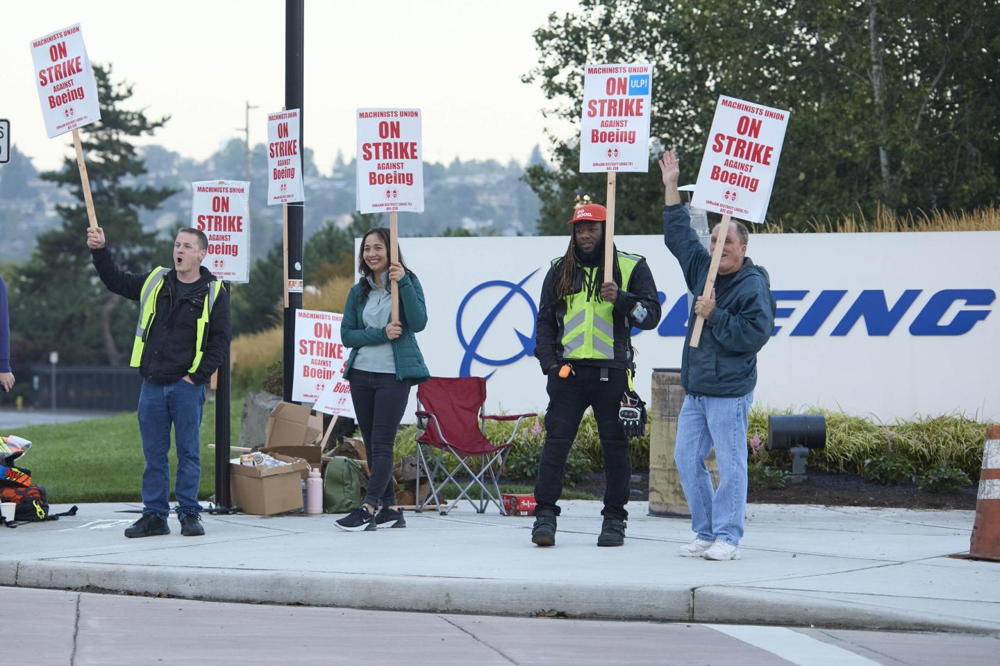 workers holding picket signs