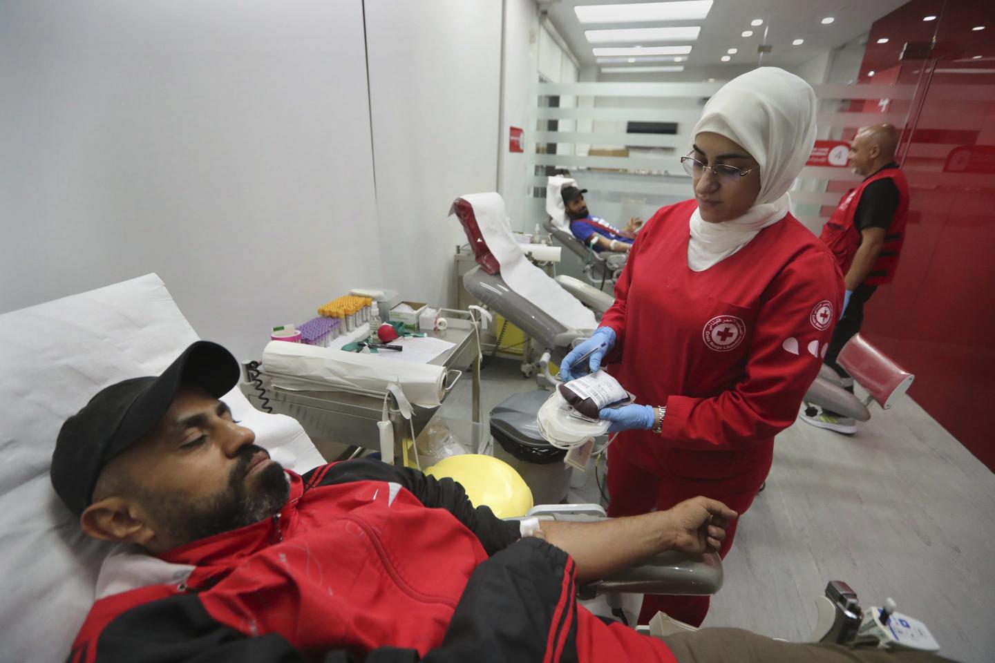 People donate blood for those who were injured by their exploded handheld pagers.