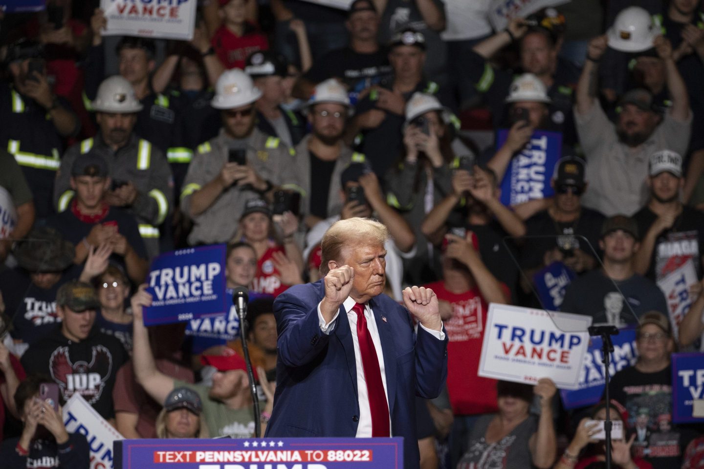 Republican presidential nominee former President Donald Trump dances after finishing his remarks at a campaign rally.