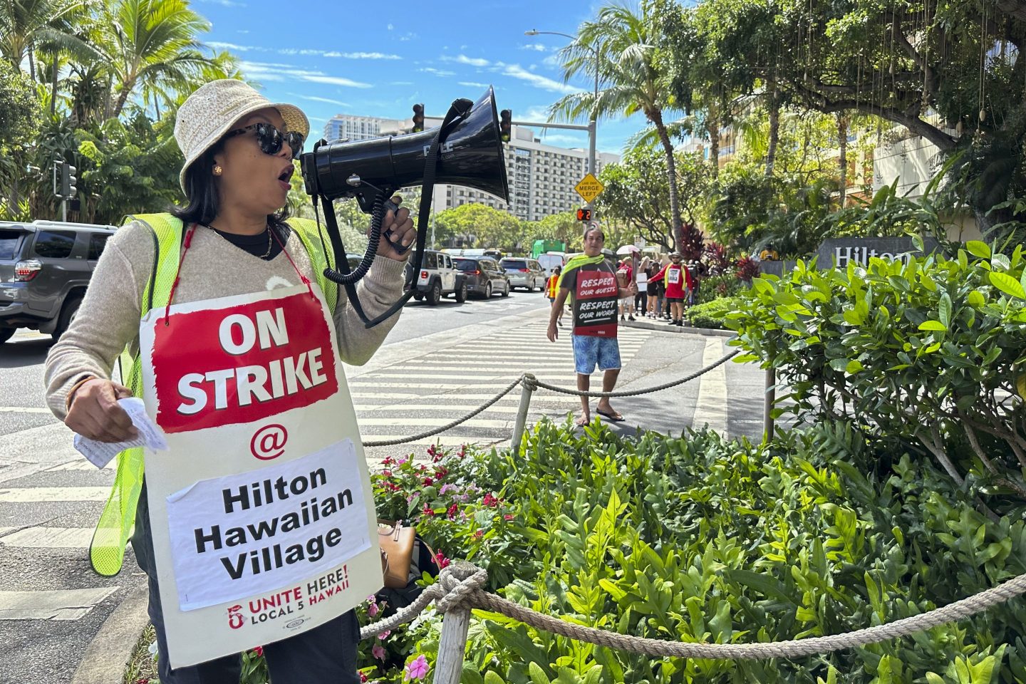 Estella Fontanilla, a housekeeper on strike from the Hilton Hawaiian Village, leads fellow hotel workers in strike chants on Sept. 24, 2024, in Honolulu.