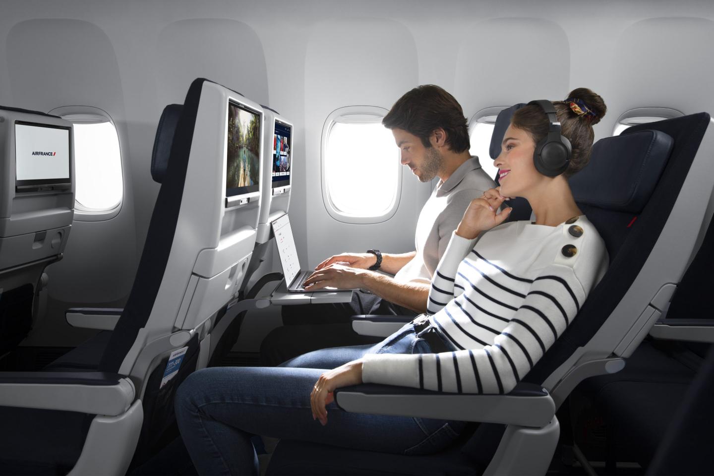 Passengers on a Boeing 777 in economy class with Air France.