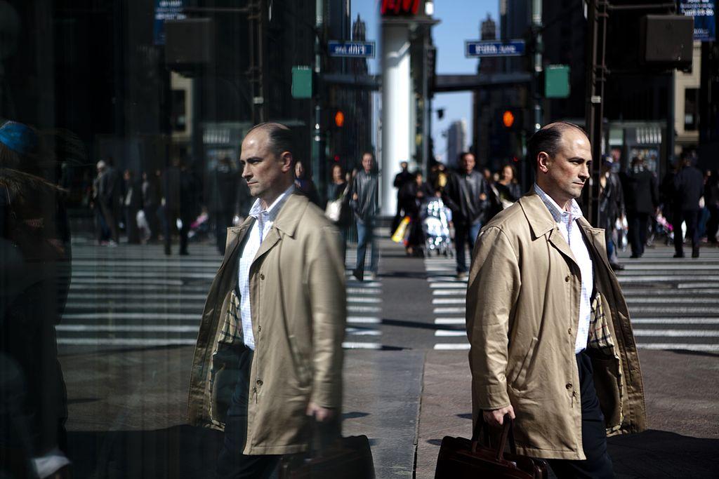 A man with a briefcase walks the streets of Midtown Manhattan, home to many of the world's banks.