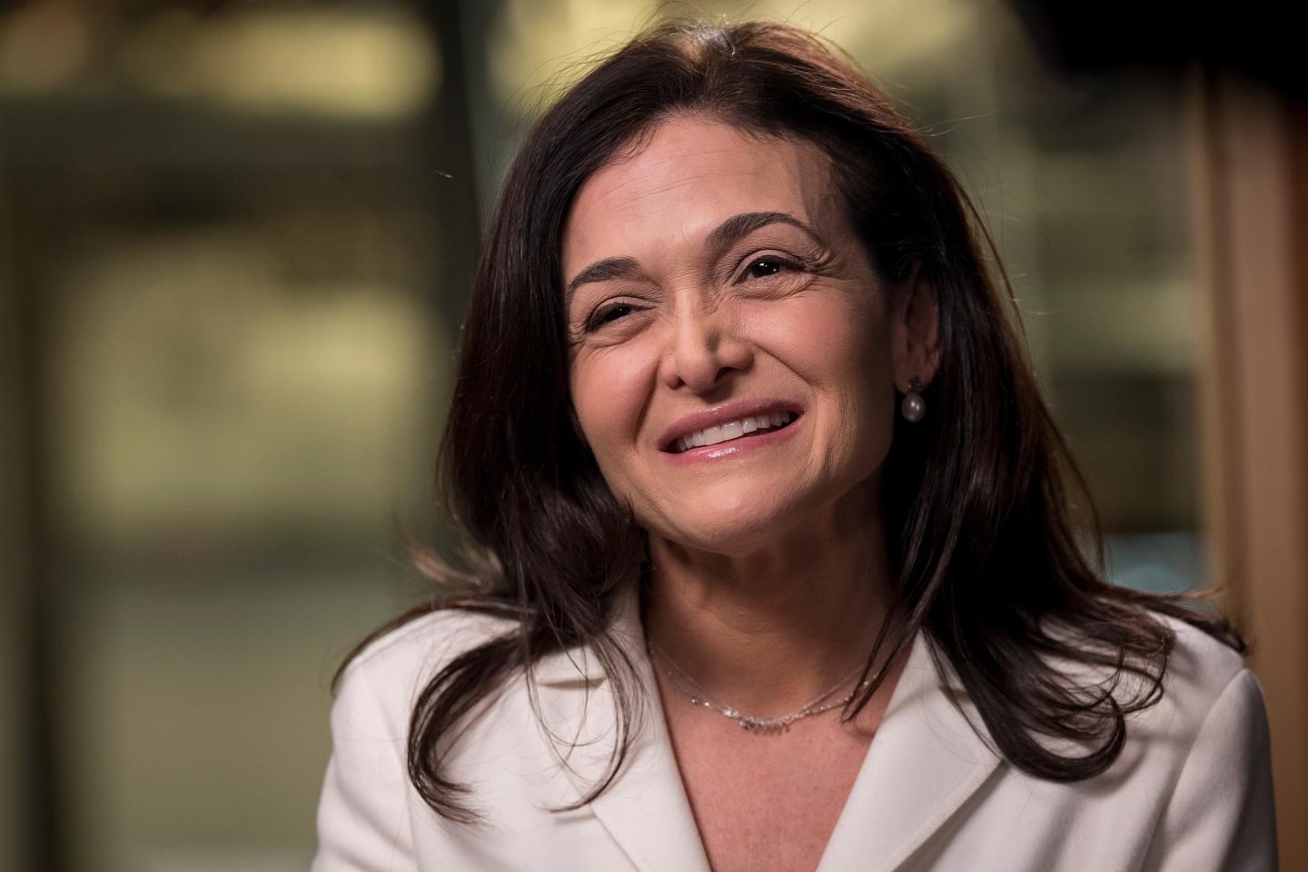 Sheryl Sandberg, chief operating officer of Facebook Inc., smiles during a Bloomberg Television interview at the company's headquarters.