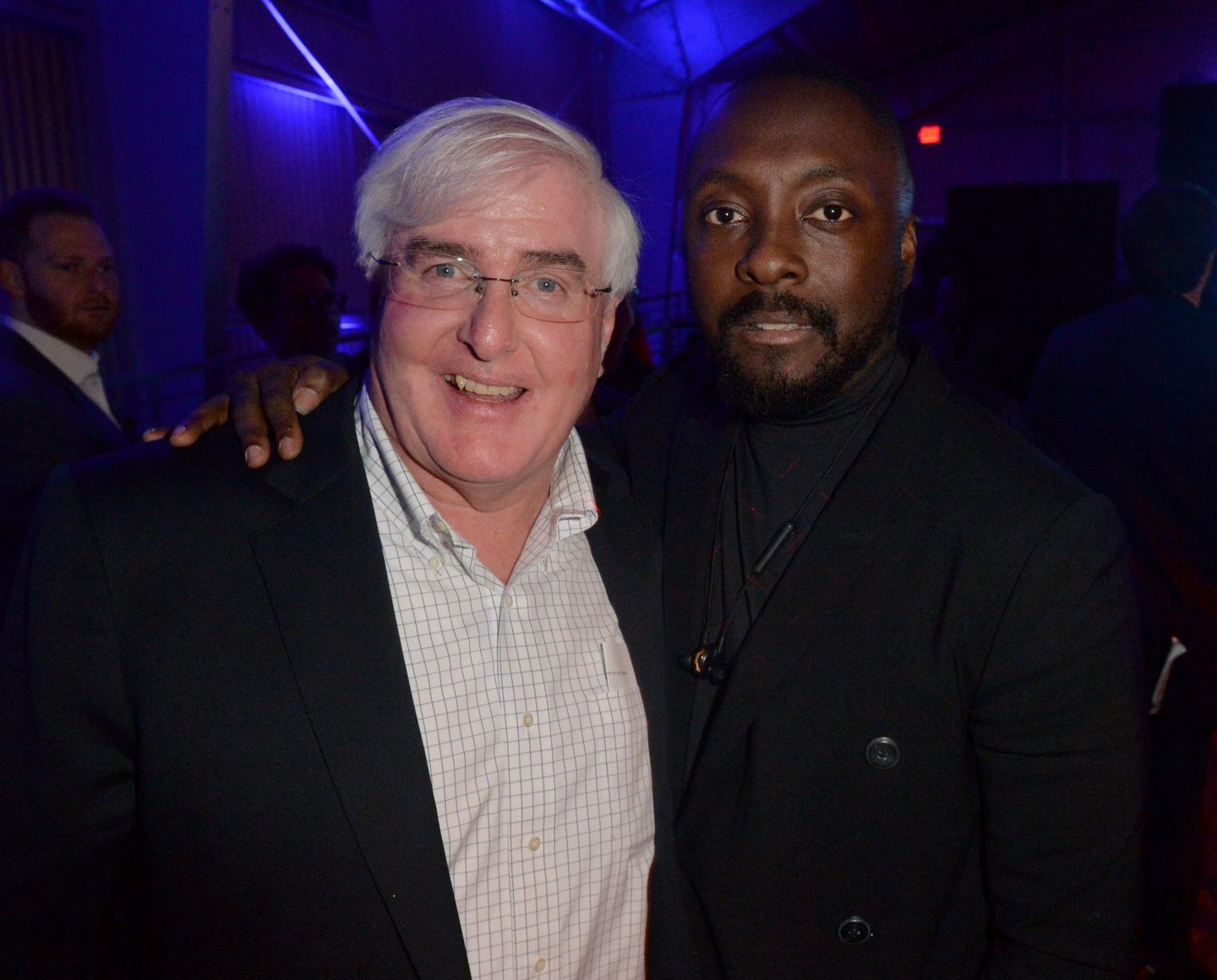 Ron Conway poses with will.i.am. at an event.