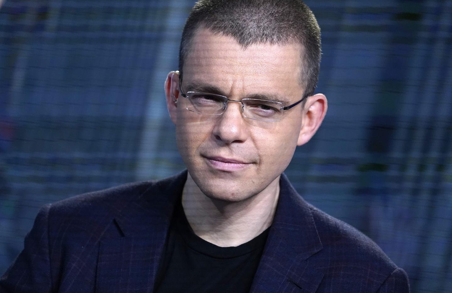 PayPal Co-Founder & Affirm CEO Max Levchin is seen in a dark blazer and black shirt with glasses.