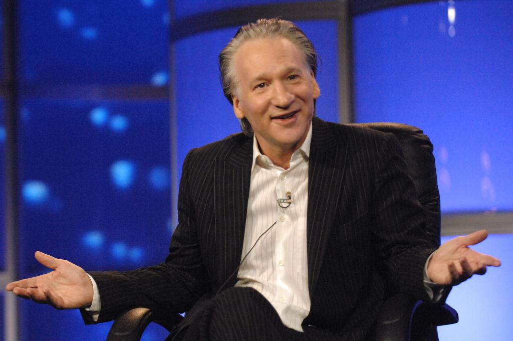 Image of Bill Maher, well-known comedian and television host, sitting in a chair