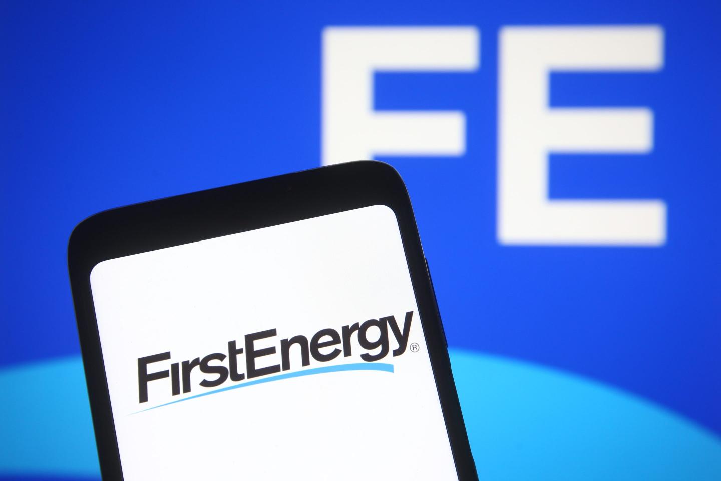FirstEnergy logo of an US electric services company is seen on a smartphone