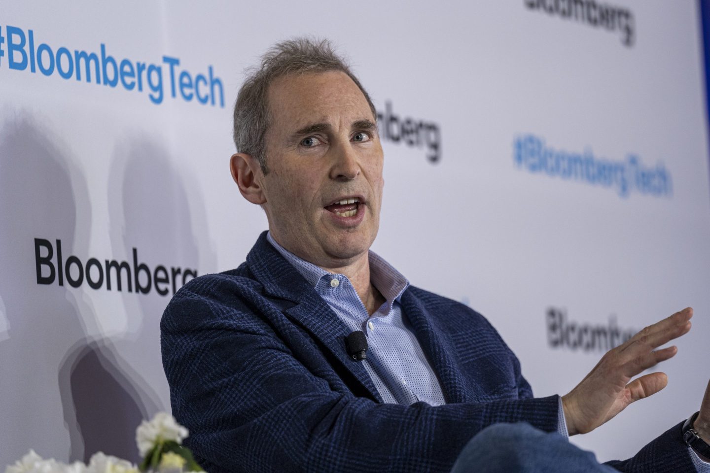 Andy Jassy gestures with his hand as he speaks.