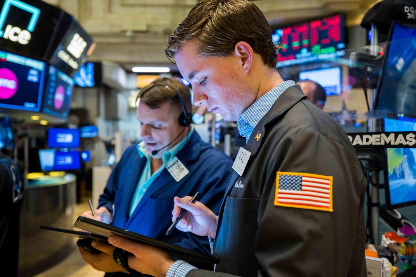 Traders are seen working at the New York Stock Exchange.