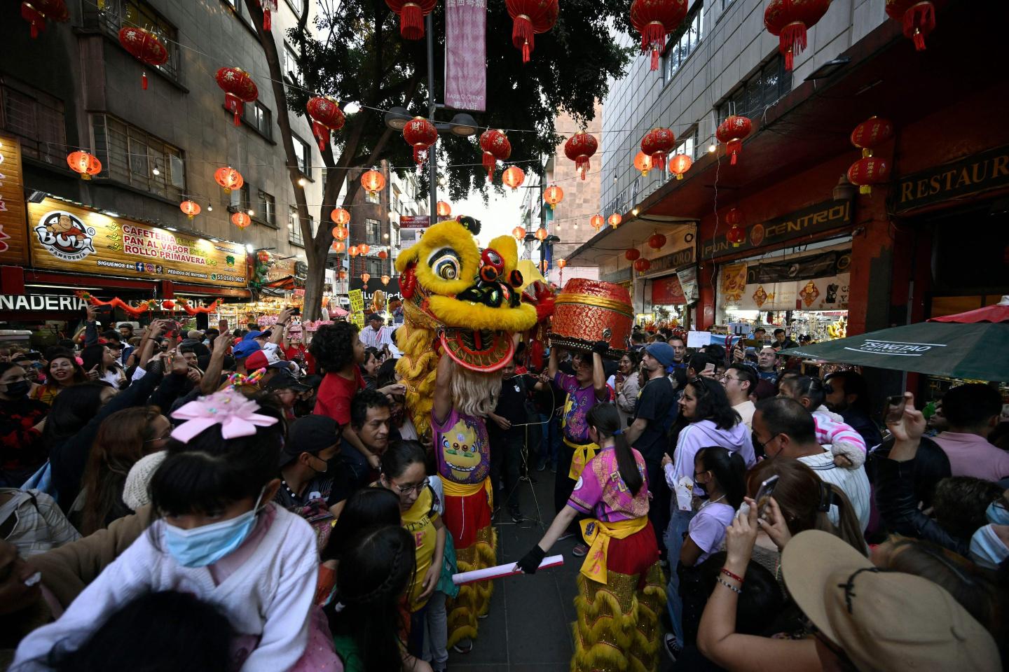 People take part in the festivities for the Lunar New Year in Mexico City's Chinatown