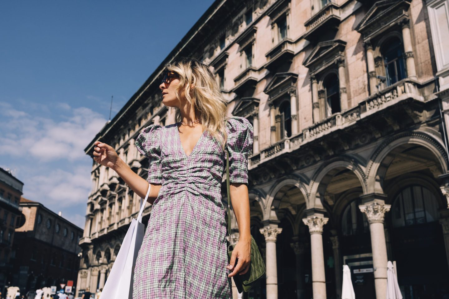 a woman carrying a shopping bag