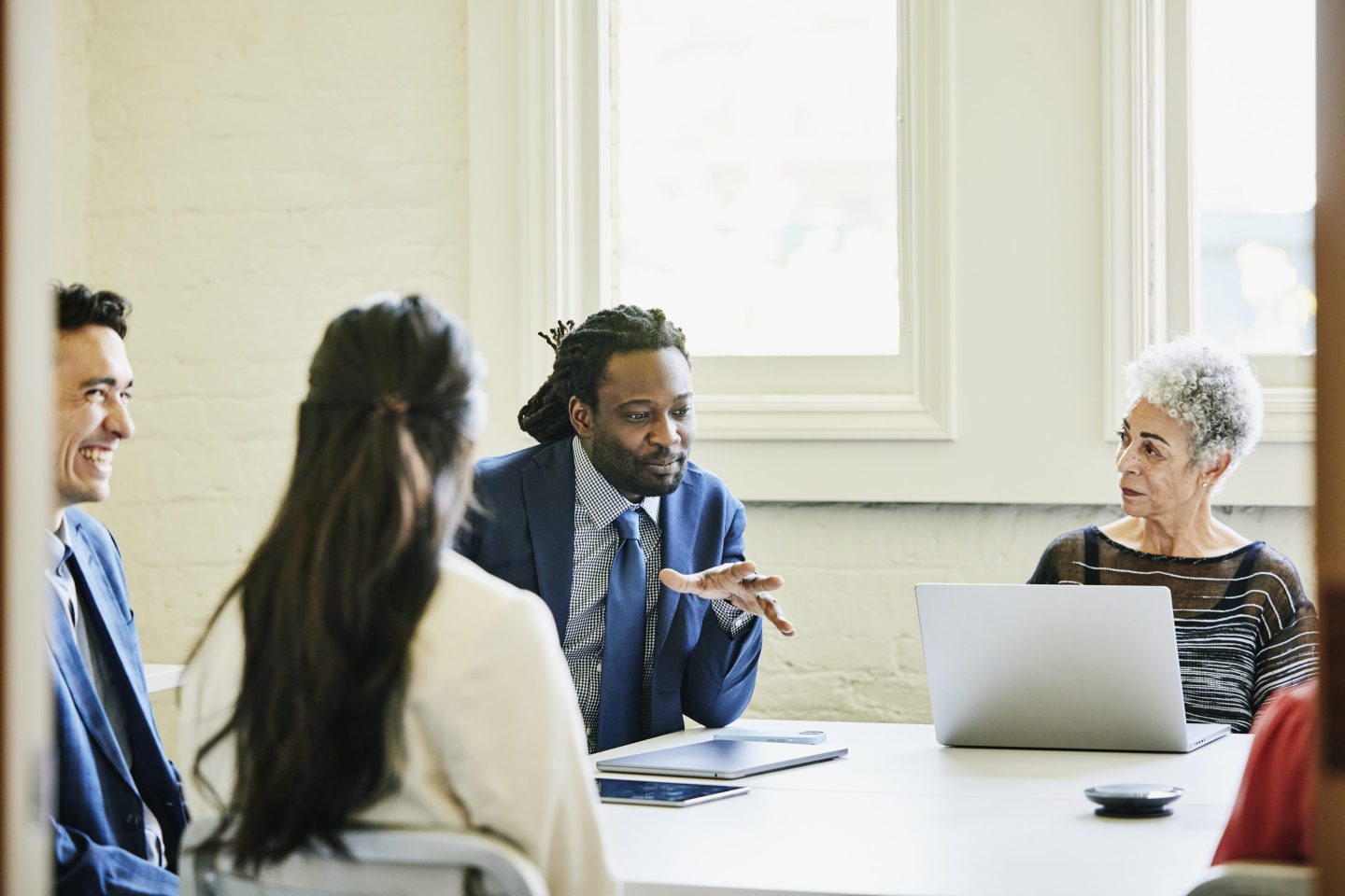 CHRO talks during a board room discussion.