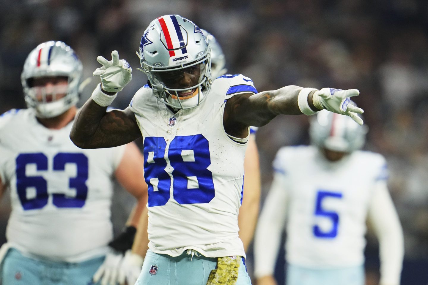 CeeDee Lamb #88 of the Dallas Cowboys celebrates after scoring a touchdown.