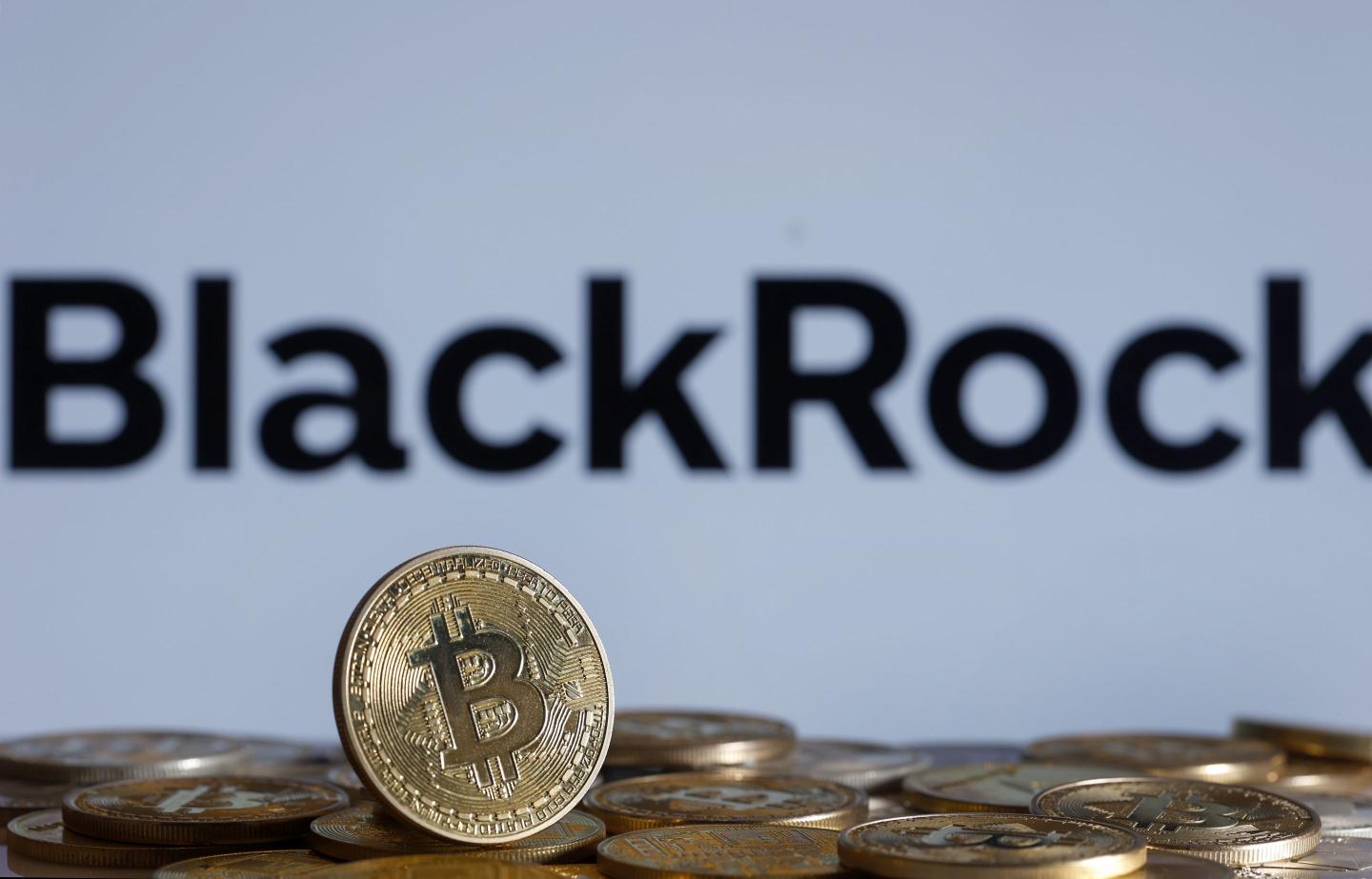 Gold coin with Bitcoin symbol in front of BlackRock logo