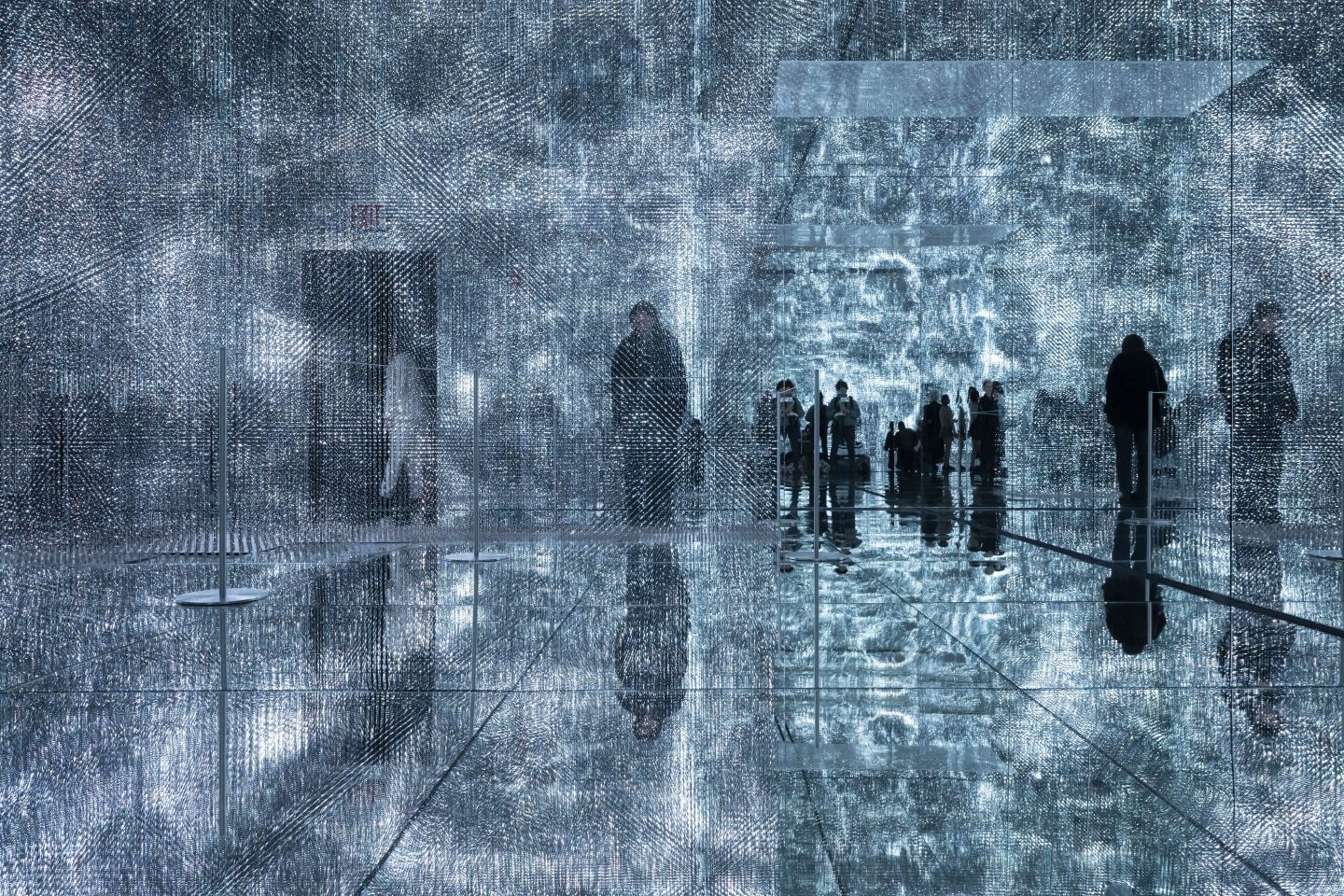 Visitors walk through installations by artist Roy Nachum at Mercer Labs Museum of Art and Technology during an exhibition preview on Feb. 29 in New York.