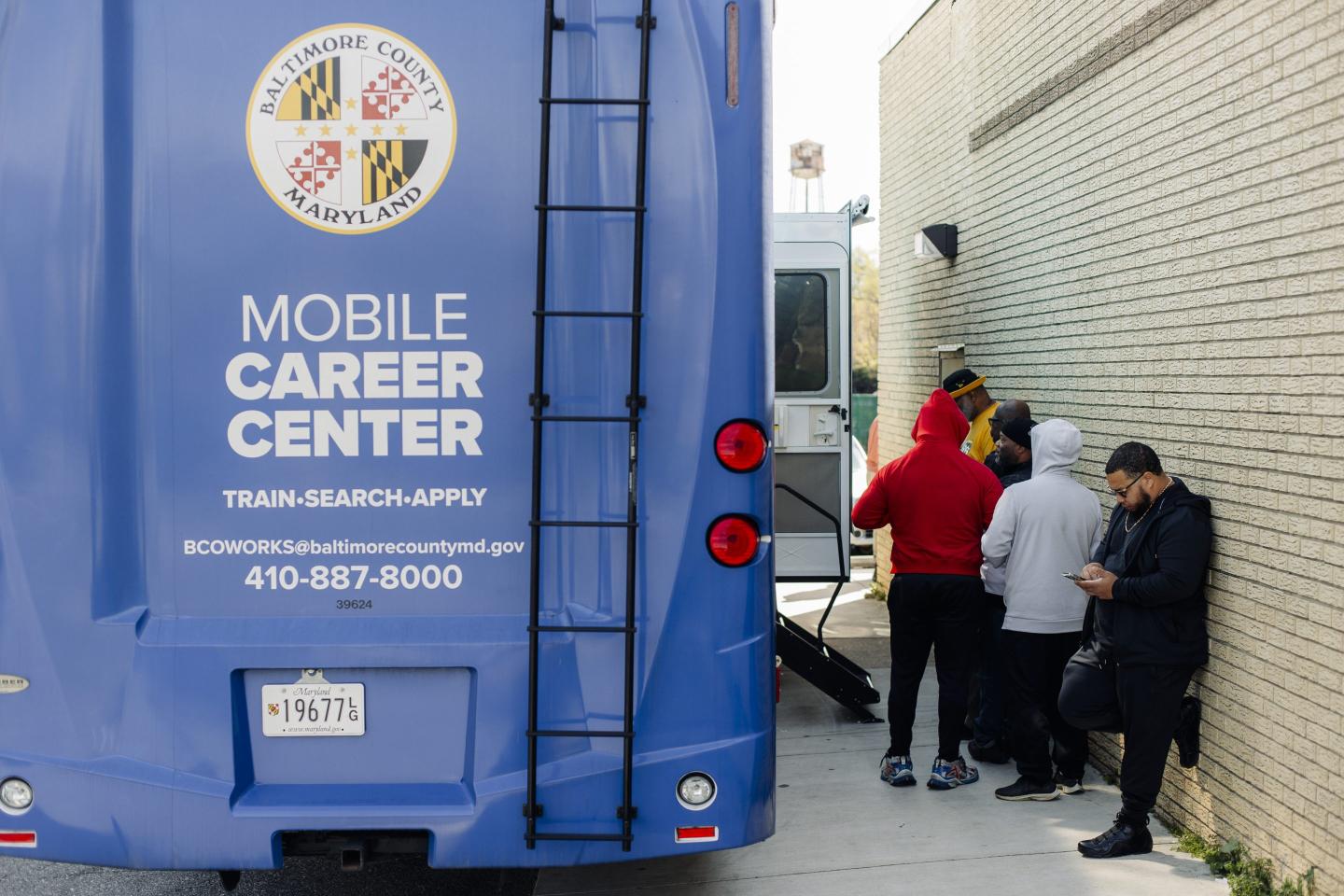 Longshoreman who have lost work since the Key Bridge collapsed wait outside The Mobile Career Center, part of the County's Economic and Workforce Development System, outside the Steamship Trade Association on April 8, 2024 in Baltimore.