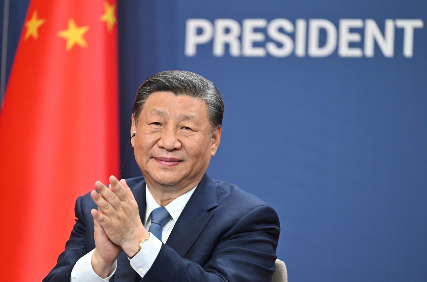 Xi Jinping claps hands