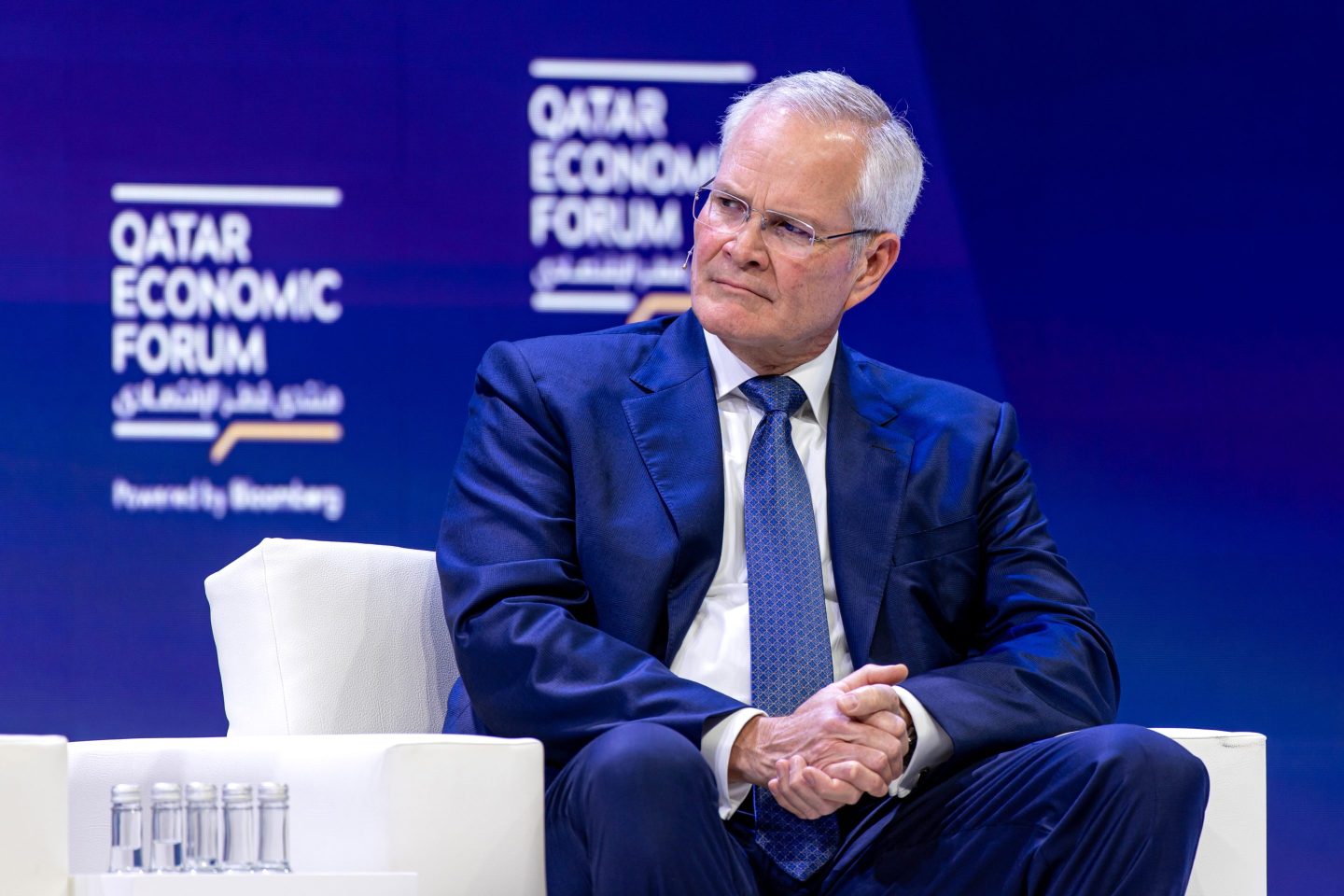 ExxonMobil CEO Darren Woods sits in a comfy chair in Qatar