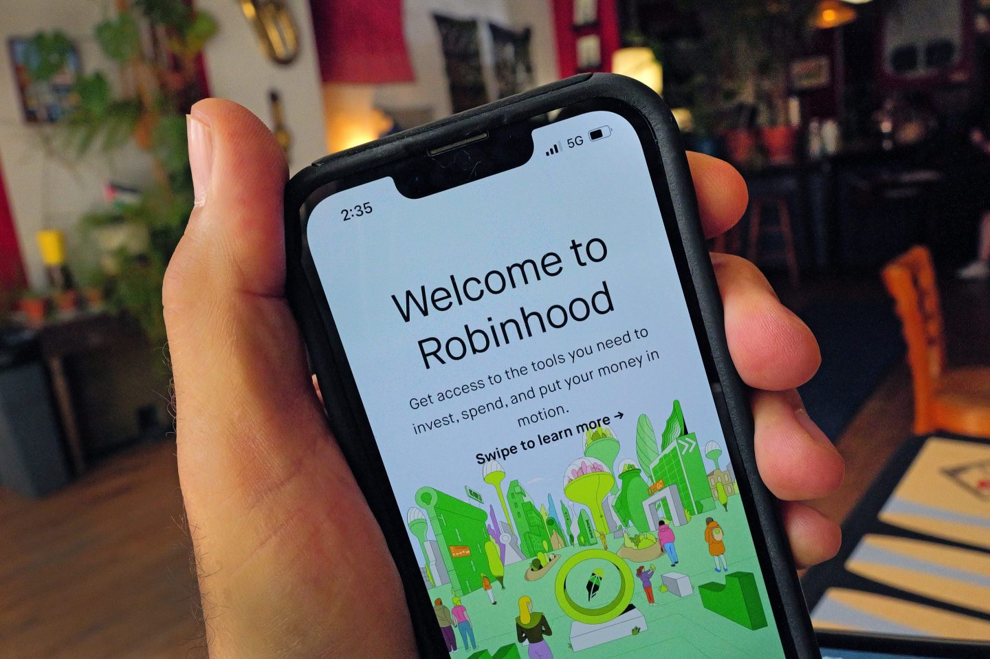 The Robinhood Markets Inc. app is shown on a cell phone.