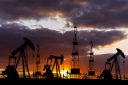oil rigs at sunset