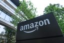 The Amazon logo is seen on a plaque outside a building.