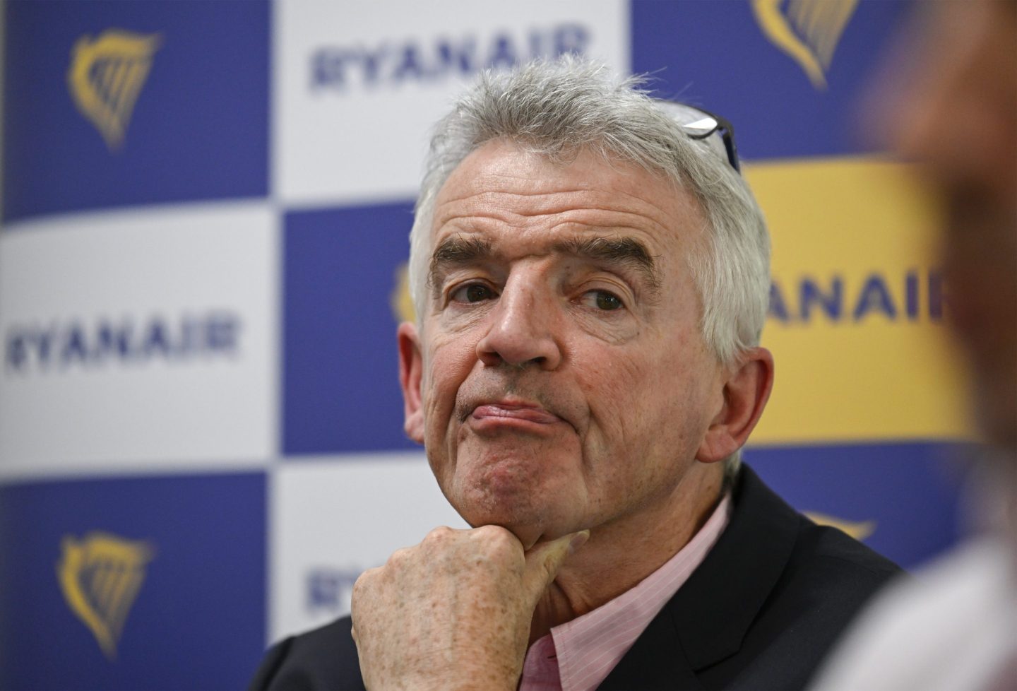 Ryanair Group CEO Michael O'Leary listens to a question during a press conference with Eddie Wilson, CEO of Ryanair, and Jason McGuinness, Commercial Director, to talk about the future of the company's operation in the Portuguese market on July 23, 2024 in Lisbon, Portugal.