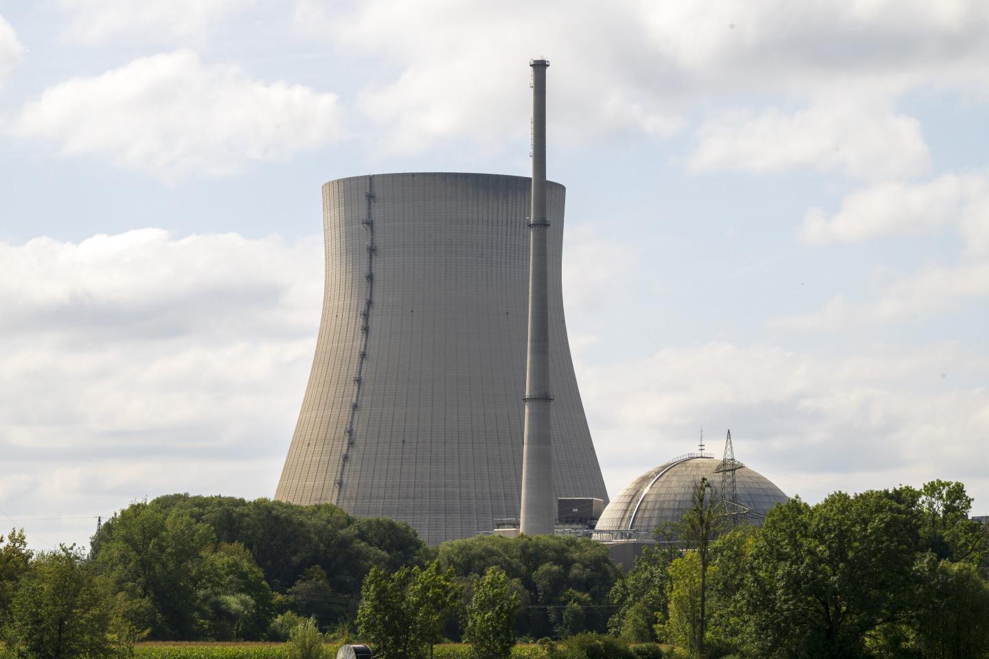 The decommissioned Isar 2 nuclear power plant is seen with greenery in the foreground.