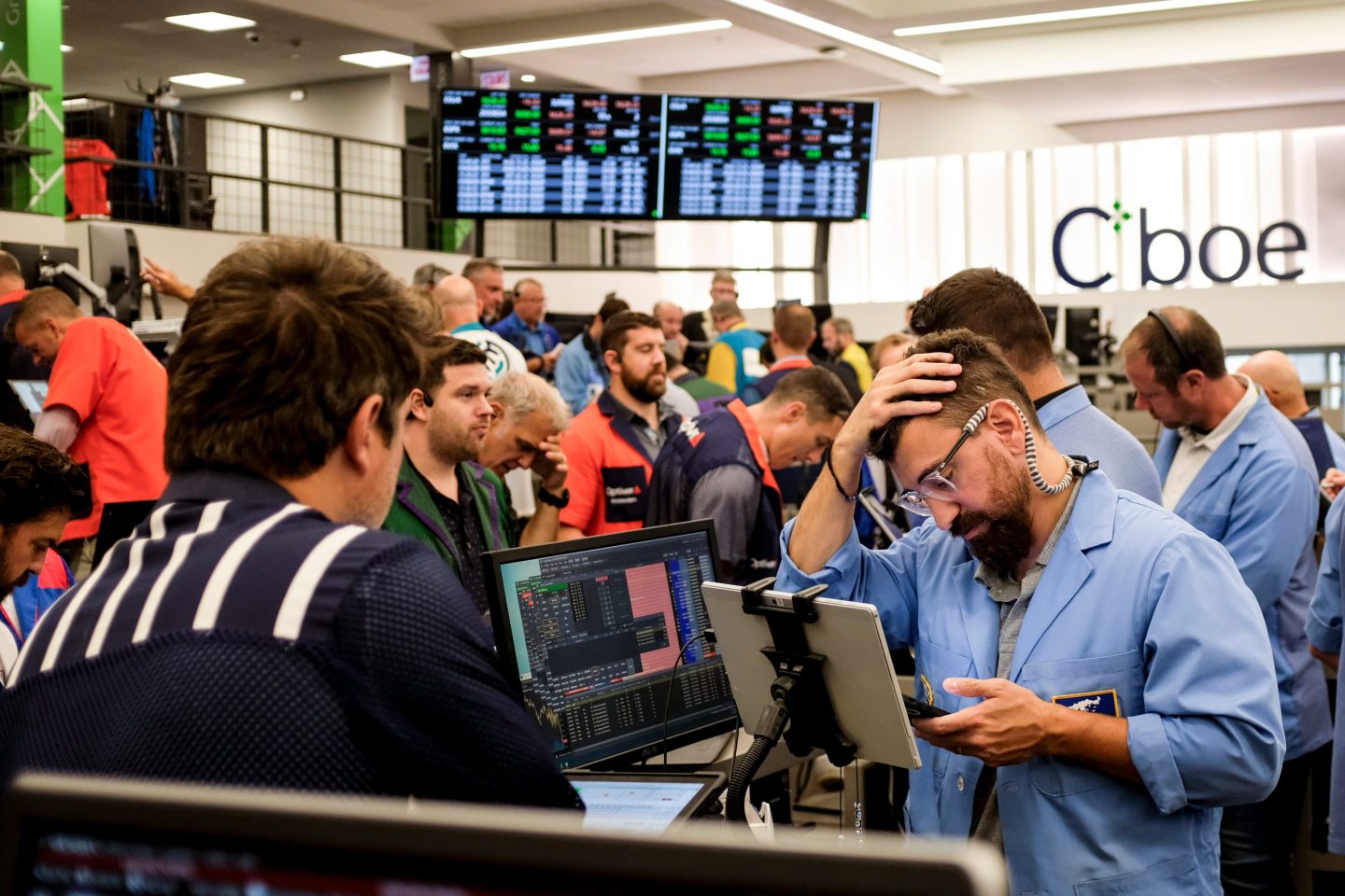 Traders work in the S&P options pit at the Cboe Global Markets exchange in Chicago