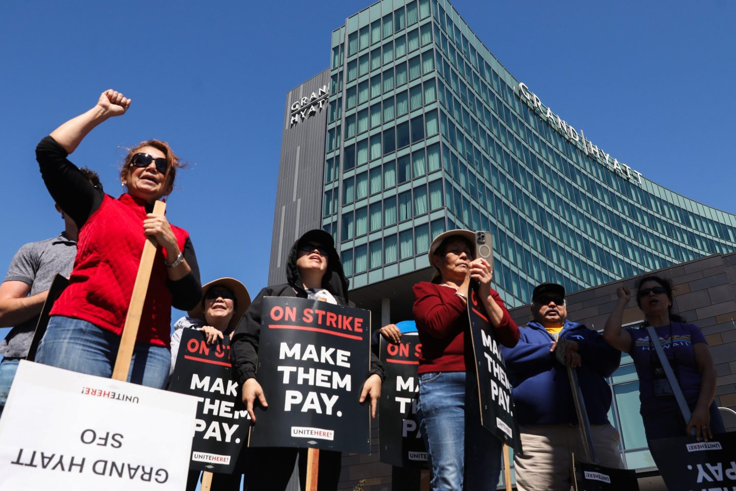 Hotel employees, local officials and members of Unite Here Local 2 union picket outside of the Grand Hyatt SFO in South San Francisco