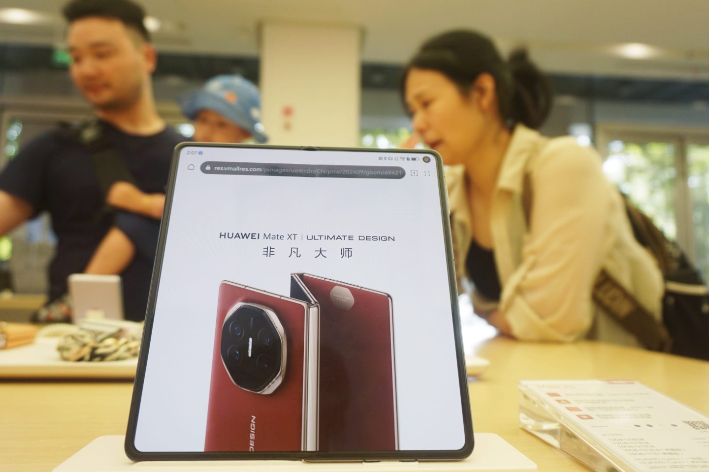 The preorder page for Huawei’s triple-foldable smartphone, the Mate XT, pictured at a Huawei store in Hangzhou, China, Sept. 8, 2024.