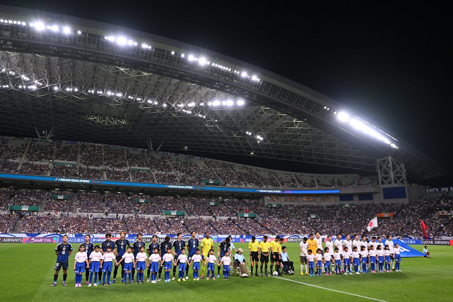 Japan and China players line up prior to the FIFA World Cup Asian 3rd Qualifier Group C match between Japan and China at Saitama Stadium on Sept. 5, 2024 in Saitama, Japan. 