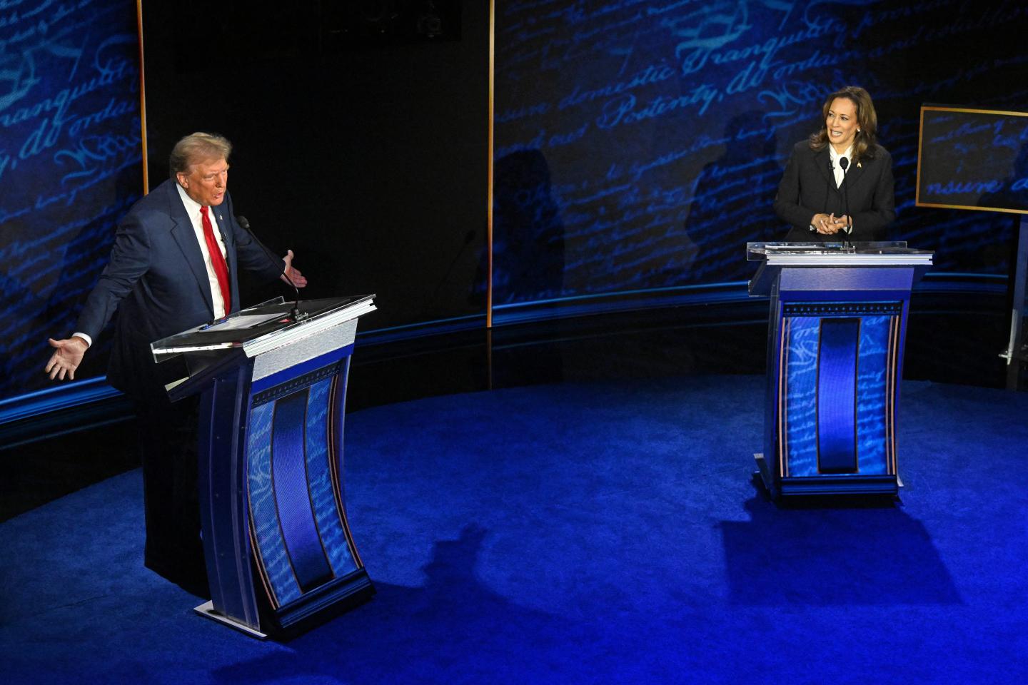 Donald Trump and Kamala Harris at podiums on debate stage