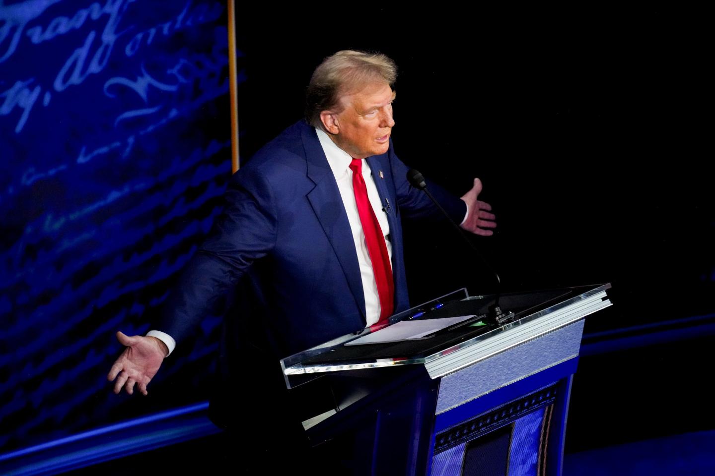 Donald Trump holds arms out