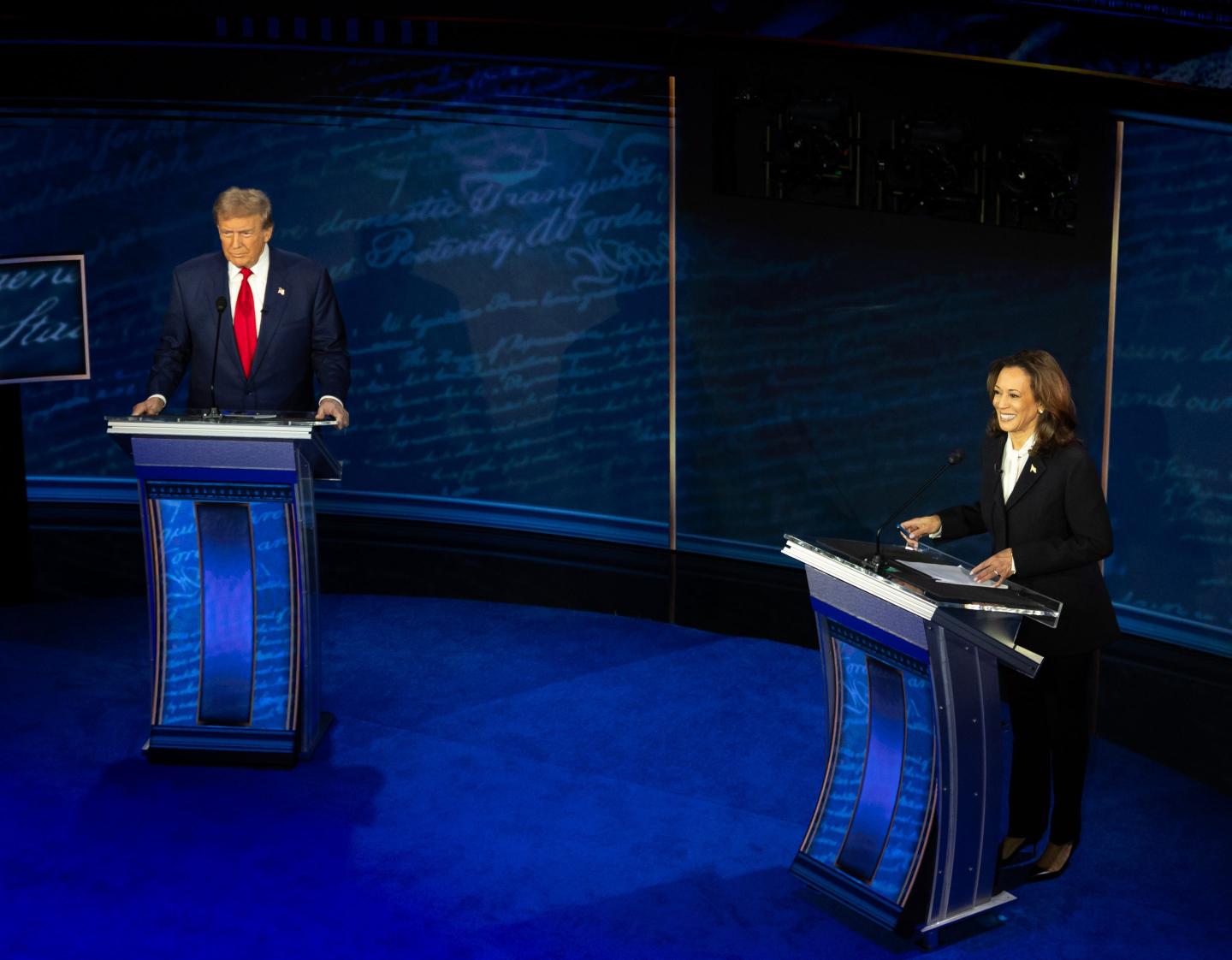 Donald Trump and Kamala Harris are seen behind their respective podiums at their first and only presidential debate in September.