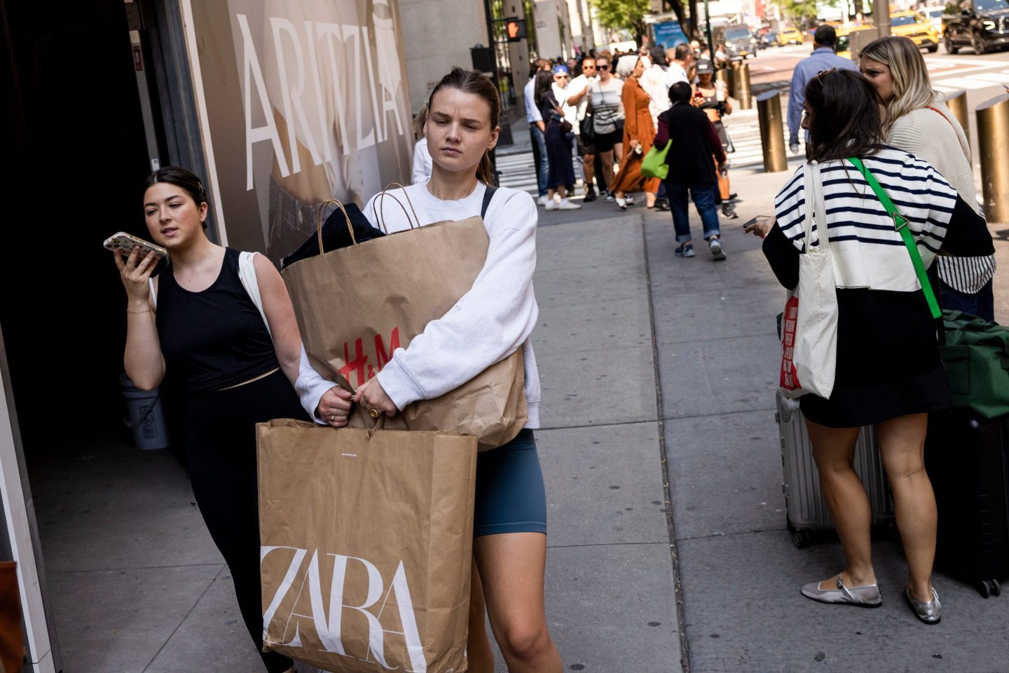 Shoppers increased their spending last month as inflation continued to cool.