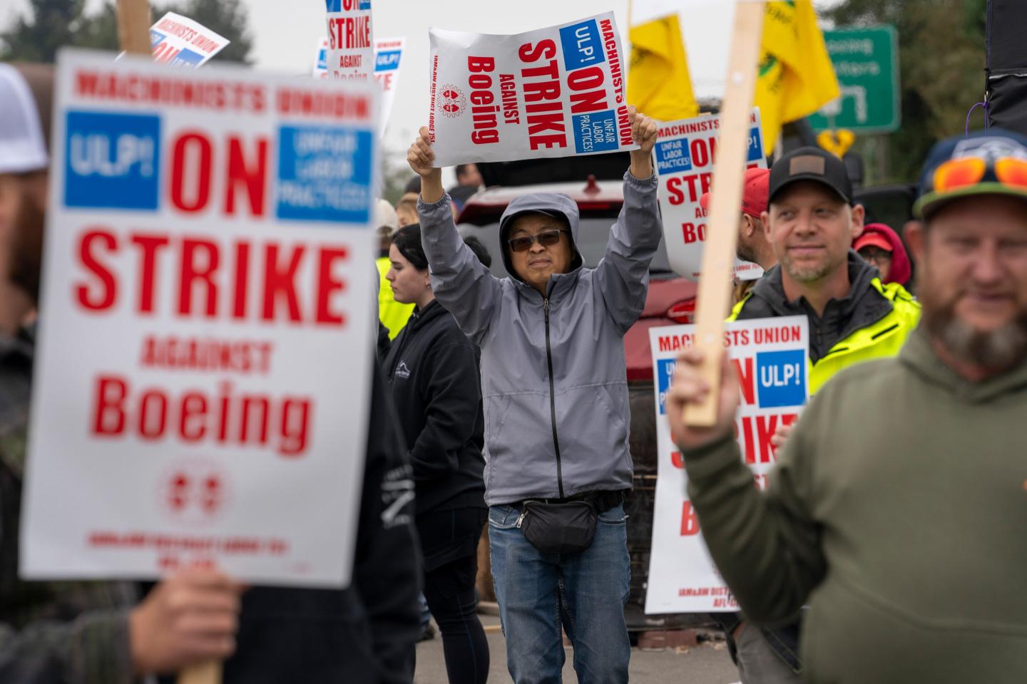 Workers picket outside a Boeing Co. facility during a strike in Everett, Washington, US, on Monday, Sept. 16, 2024. Boeing Co. factory workers walked off the job for the first time in 16 years, halting manufacturing across the planemaker's Seattle hub after members of its largest union voted overwhelmingly to reject a contract offer and go on strike. Photographer: M. Scott Brauer/Bloomberg via Getty Images