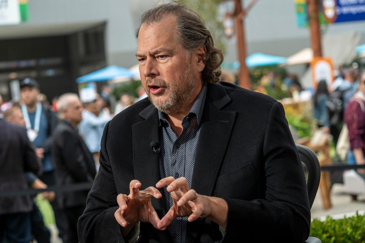 Marc Benioff, chief executive officer of Salesforce Inc., during a Bloomberg Television interview. He is gesturing with his hands and mid-speech. He wears a professional jacket and shirt.