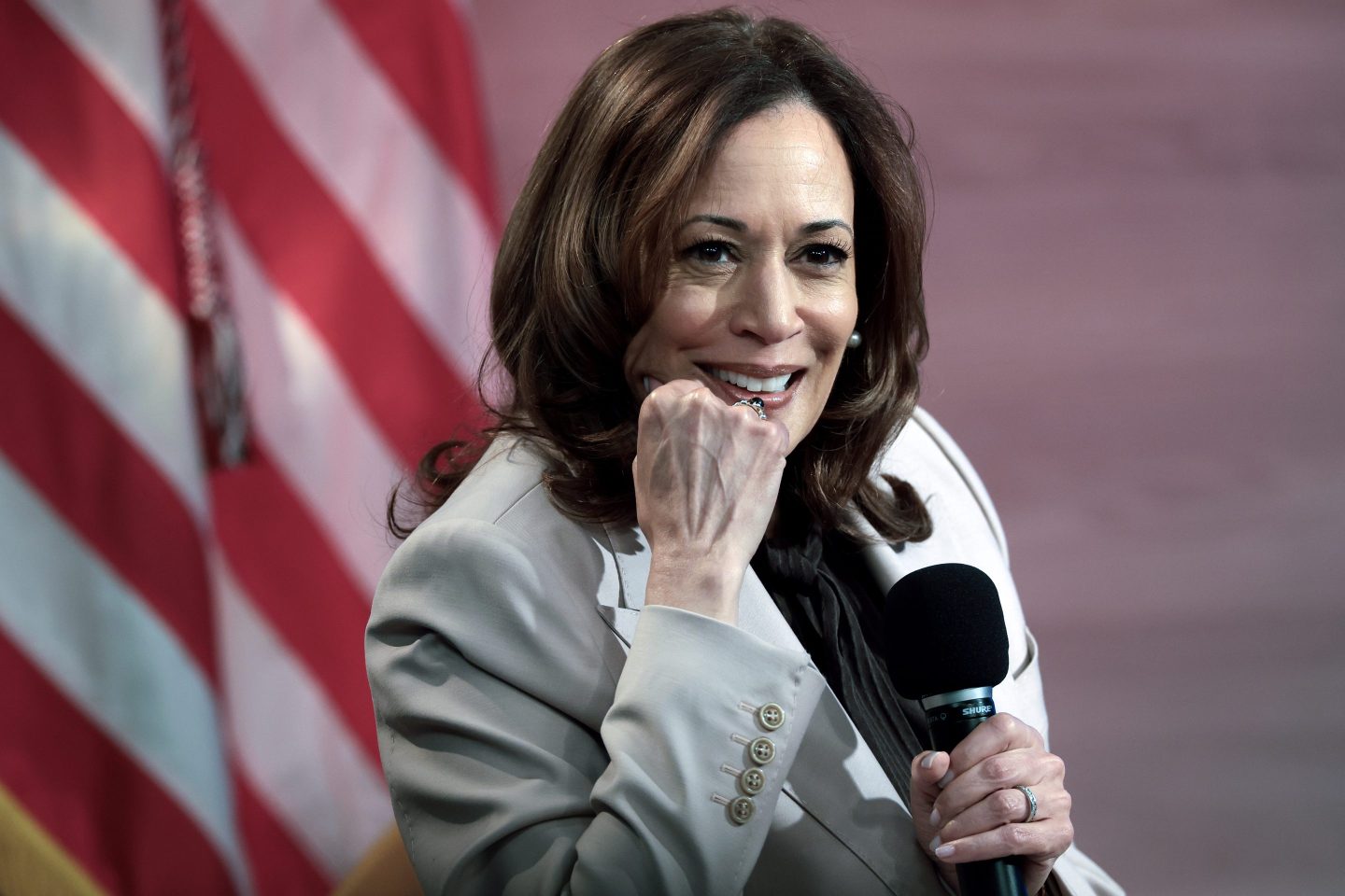 Kamala Harris holds microphone