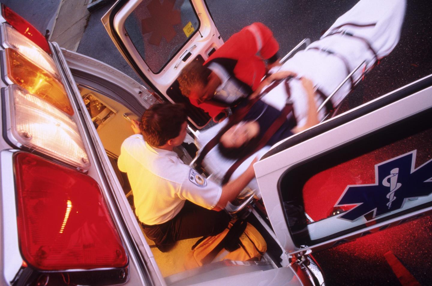 Emergency squad helps ailing patient.